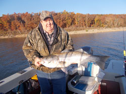 Bernie with his 18 lb striper he fished with STR Outfitters