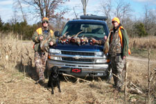 Sean & Kyle hold pheasants fron their cast & blast